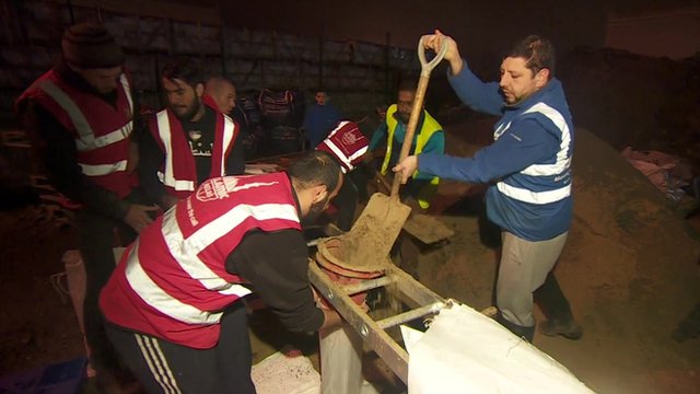 Volunteers helping with sandbags