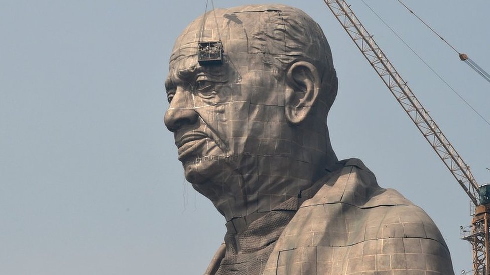 Indian workers give the finishing touches to the world's tallest statue dedicated to Indian independence leader Sardar Vallabhbhai Patel in India's western Gujarat state.