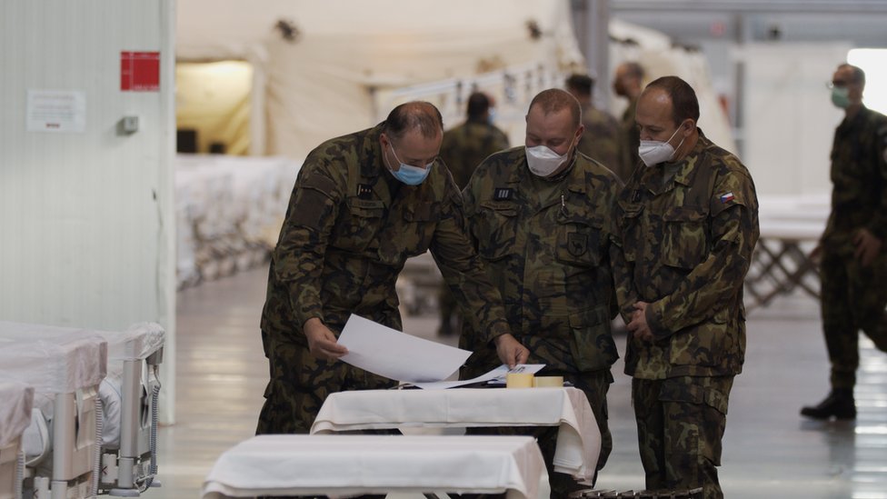 Colonel Slechta (left) with colleagues in field hospital