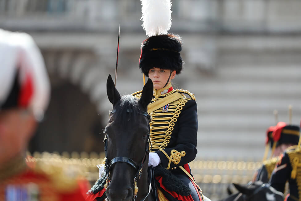 Captain Amy Cooper leads the procession on a veteran horse named Lord Firebrand