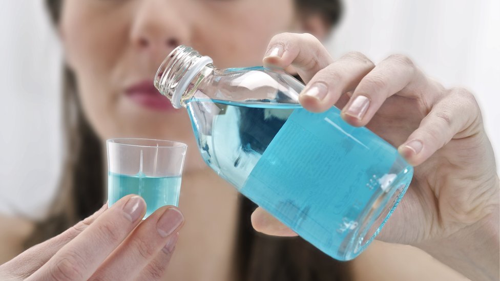 Covid: Mouthwash 'can kill virus in lab in 30 seconds' - BBC News