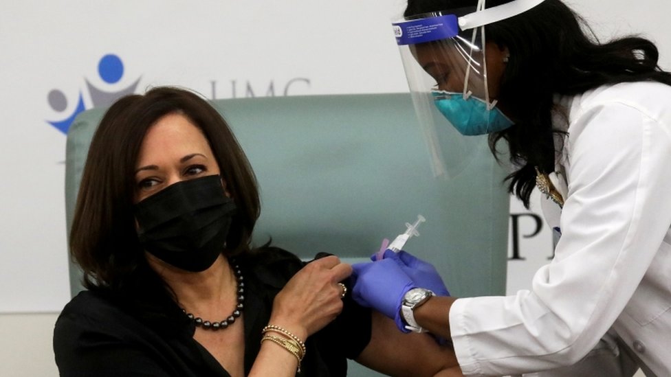 Vice President-elect Kamala Harris receives a dose of the Moderna vaccine at United Medical Center in Washington, DC