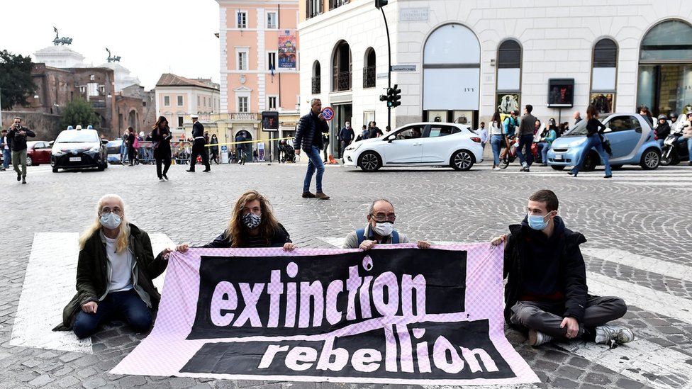 Extinction Rebellion activists protest as they block a road during the G20 summit in Rome, Italy, October 31, 2021.