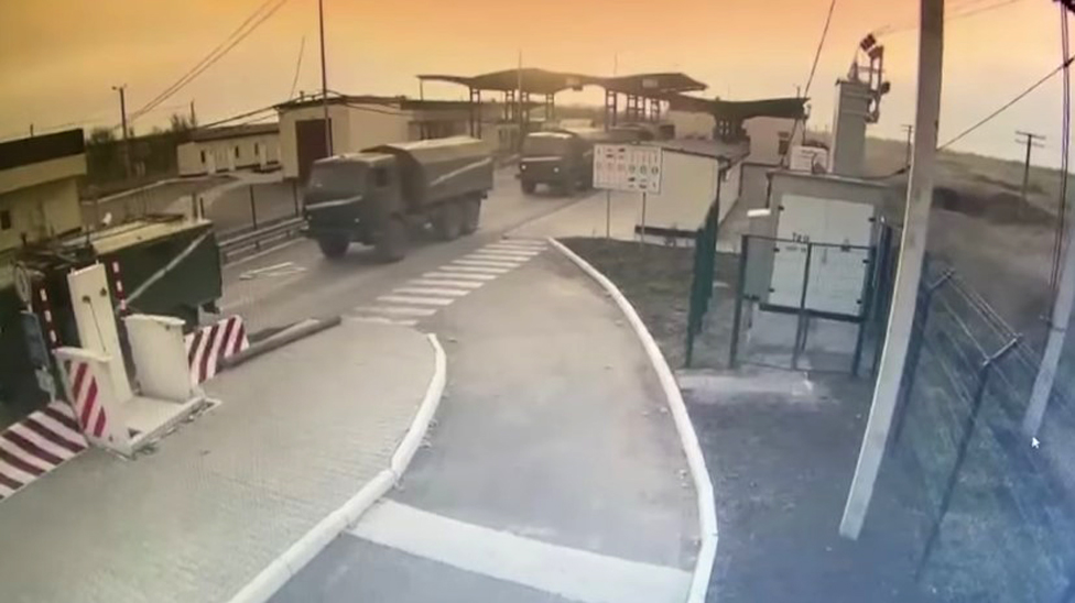 Handout screengrab taken from CCTV issued by State Border Guard Service of Ukraine of Russian military vehicles moving across the border from Crimea into Ukraine (exact location not given), on 24 February 2022