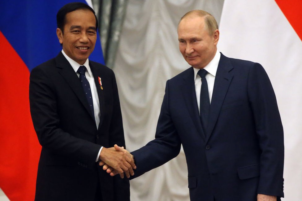 Russian President Vladimir Putin (R) shakes hands with Indonesian President Joko Widodo (L) during their talks at the Kremlin, June 30, 2022, in Moscow, Russia.