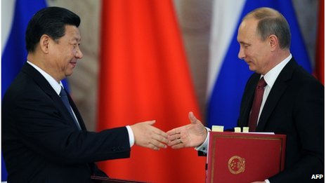 Vladimir Putin (R) and Xi Jinping (L) attend the opening ceremony of "The Year of Chinese Tourism in Russia" in Moscow, on March 22