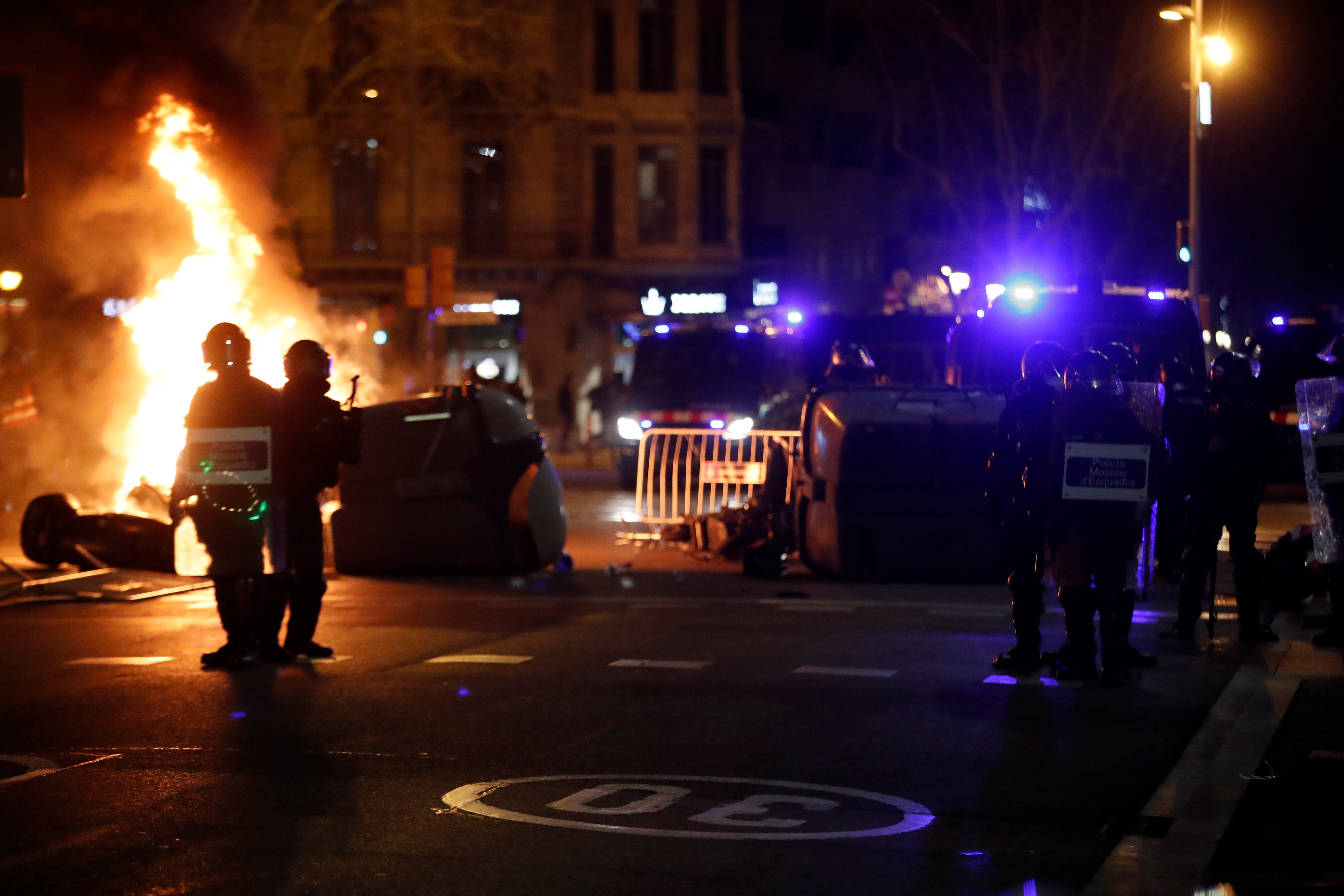 Protesters set fire to rubbish bins on Tuesday in Barcelona