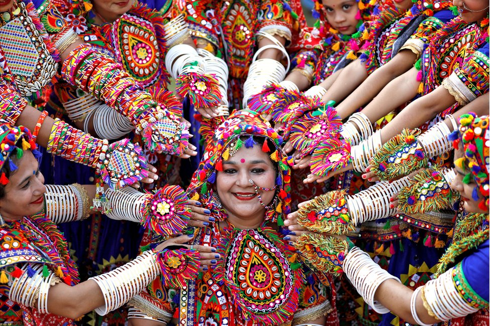 Participants dress in traditional attire and rehearse for a festival