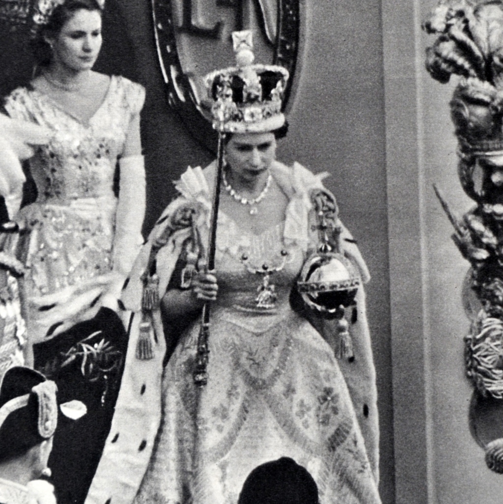 Queen Elizabeth at her coronation, holding the sceptre, topped with the Star of Africa, in her right hand.