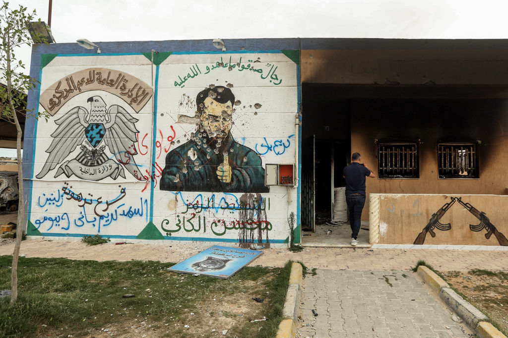 A defaced mural of Mohsen, who served as 