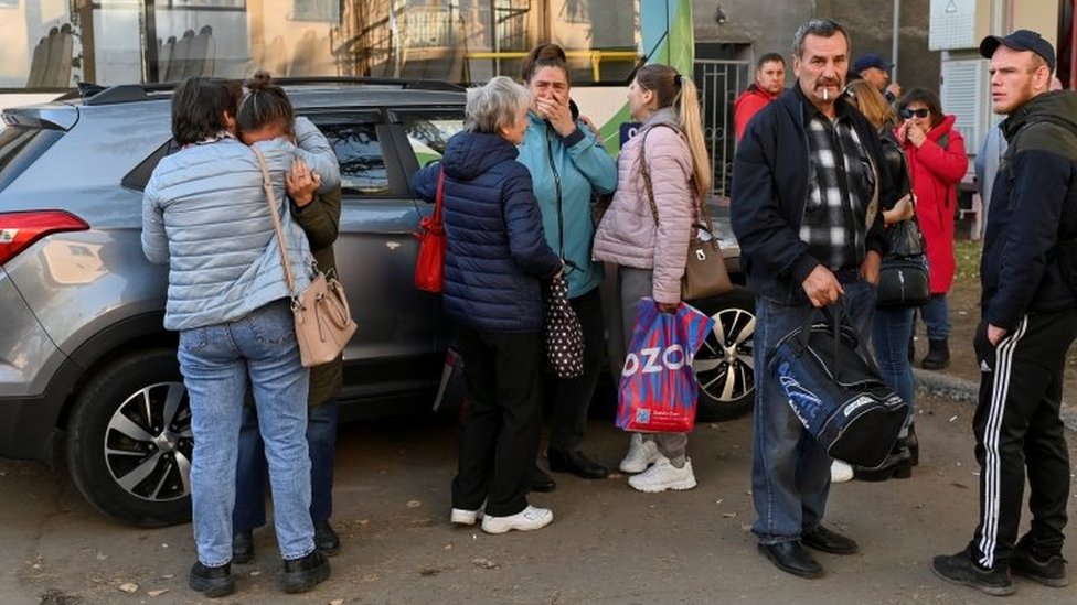 Wives and mothers of Russian reservists cry at a gathering point in Omsk, Russia. Photo: October 2022