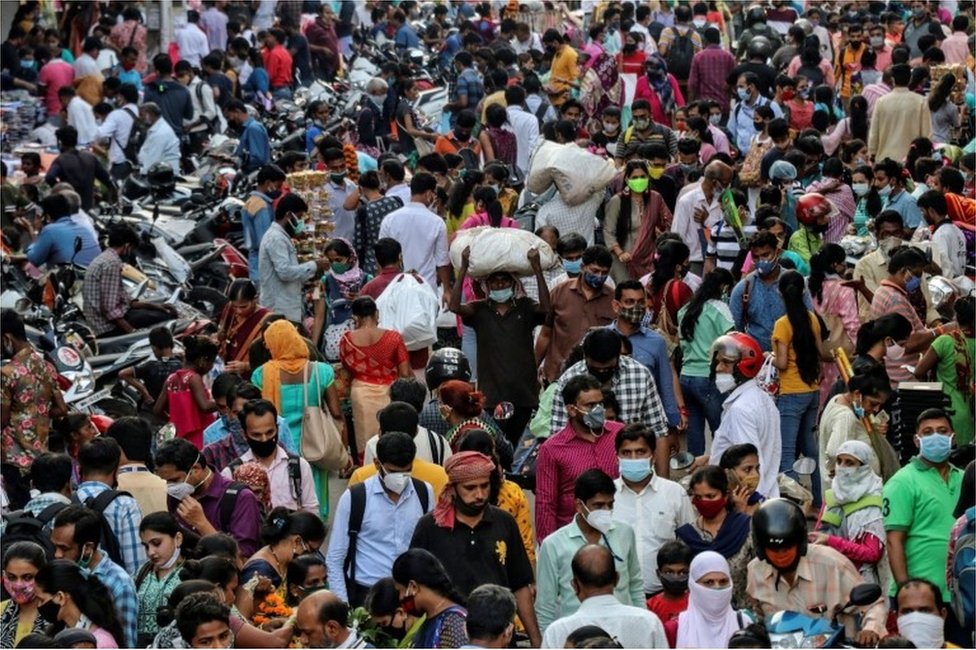 People crowd a market to shop on the eve of Diwali, amid the spread of COVID-19 in Mumbai, India, November 13, 2020.