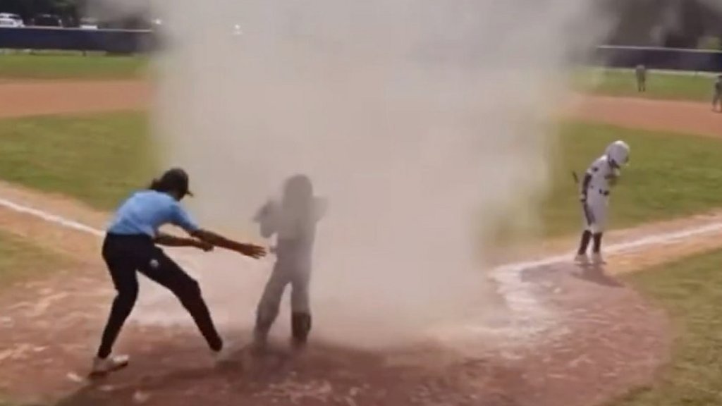 Child rescued from dust devil during baseball game