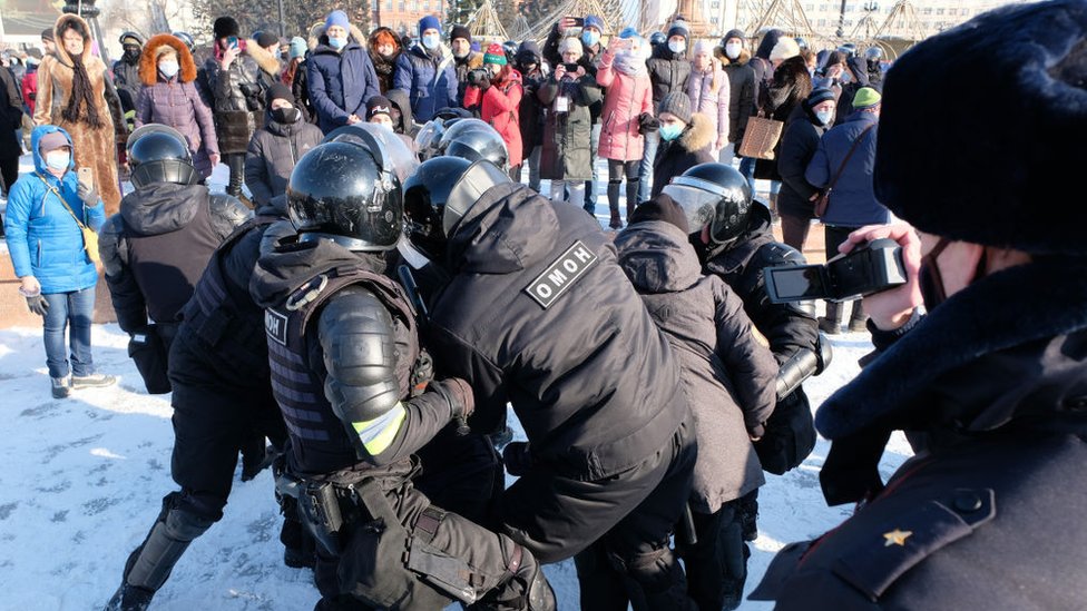 Riot police officers detain a participant in an unauthorized rally in support of Russian opposition activist Alexei Navalny in Khabarovsk