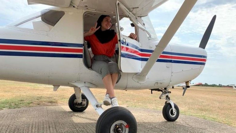 Maya Ghazal sitting on her plane
