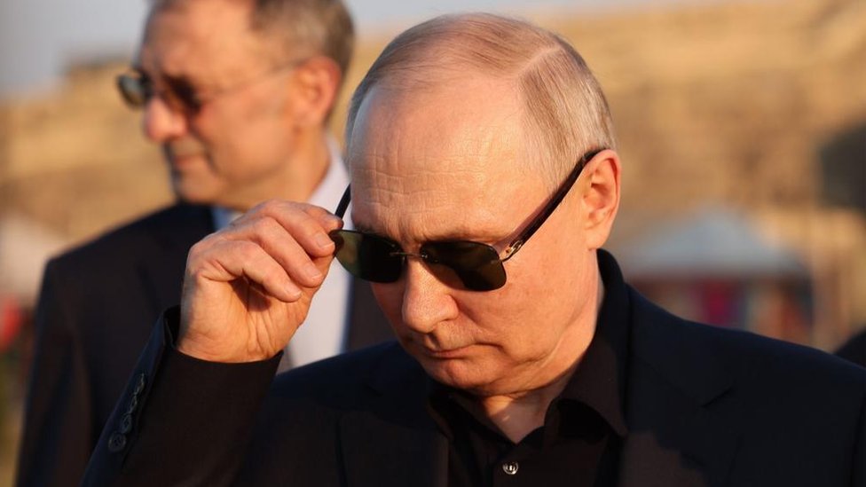 Vladimir Putin with sunglasses on