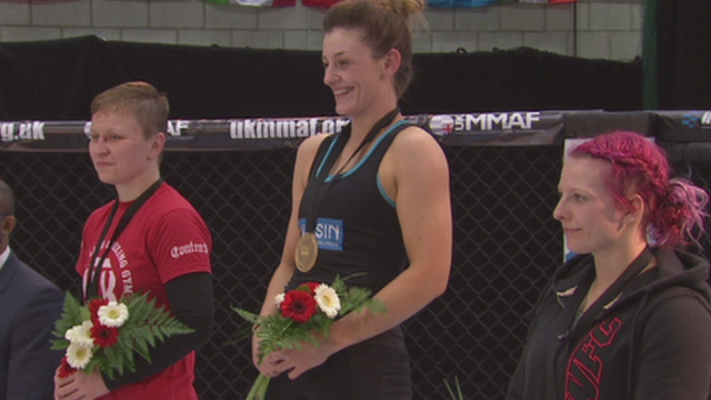 Leah McCourt receives her gold medal at the 2015 IMMAF European Open Championships of Amateur MMA