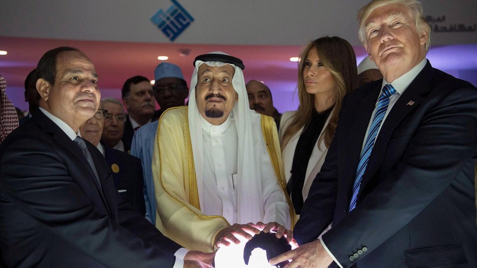 Egyptian President Abdul Fattah al-Sisi, Saudi King Salman and US President Donald Trump place their hands on a glowing globe at the opening the World Centre for Countering Extremist Thought in Riyadh, Saudi Arabia (21 May 2017)