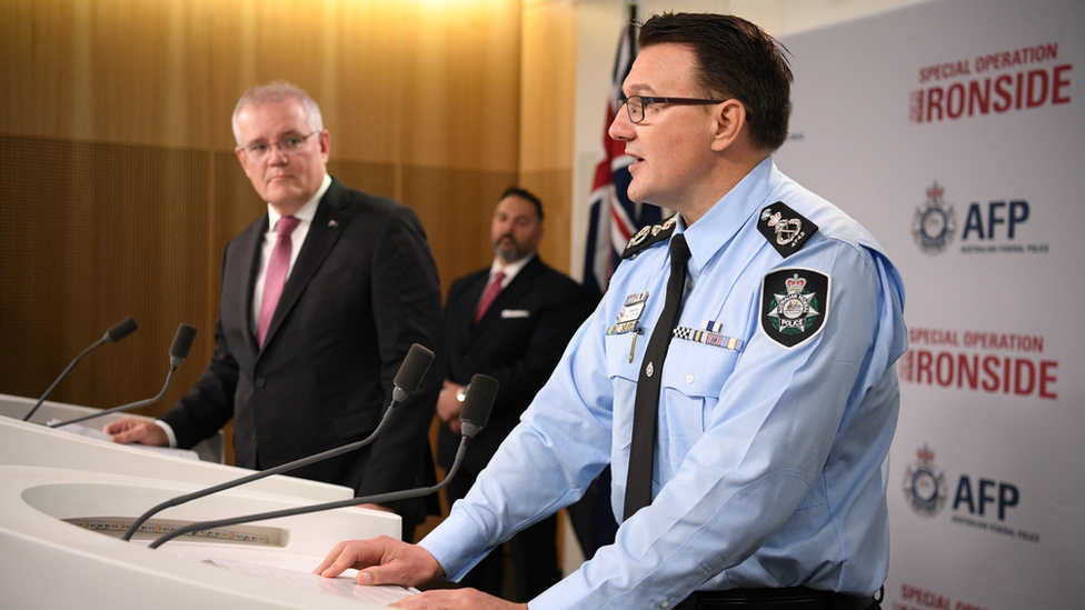 Australian Prime Minister Scott Morrison (left) and Australian Federal Police commissioner Reece Kershaw