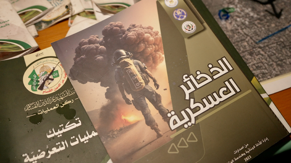 A pamphlet entitled “Military Ordnance” published by the Palestinian Authority, and another pamphlet (underneath) published by the Izzedine al-Qassam Brigades, Hamas’s military wing, which Israel Defense Forces (IDF) soldiers said they found inside Al-Shifa Hospital in Gaza City (15 November 2023)