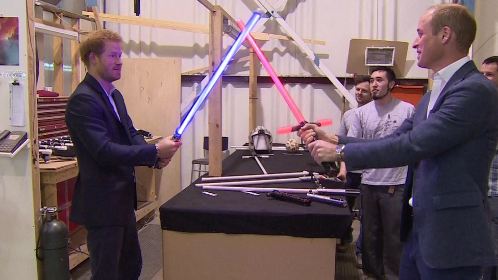 Princes William and Harry duel with lightsabers
