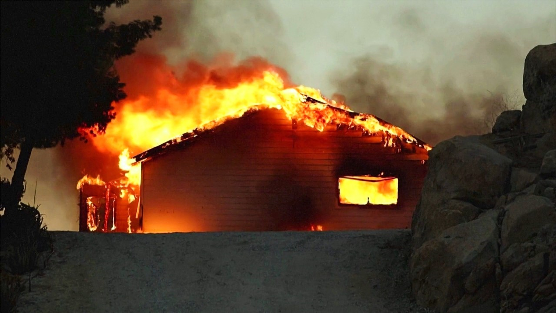 California wildfires: Two dead and mass evacuations amid heatwave