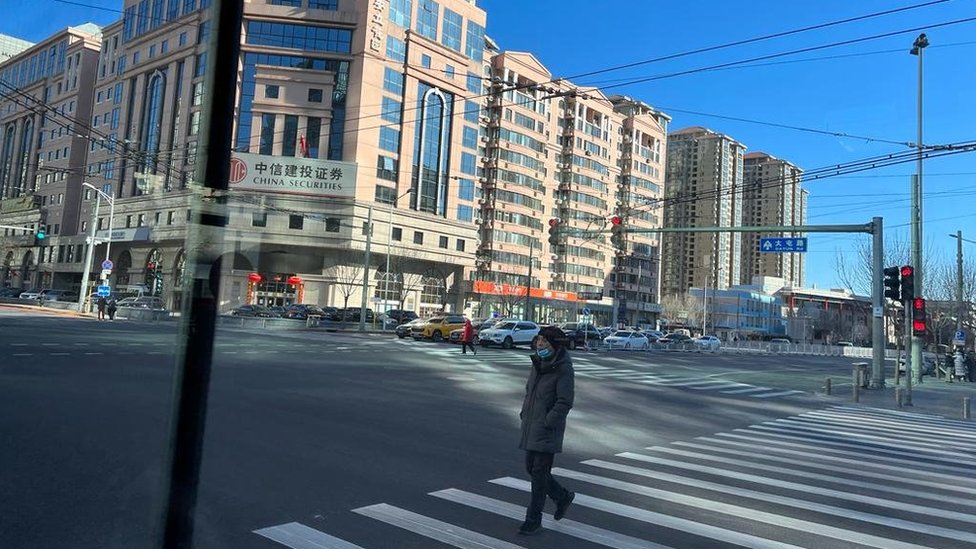 A man crosses the road on a Beijing street