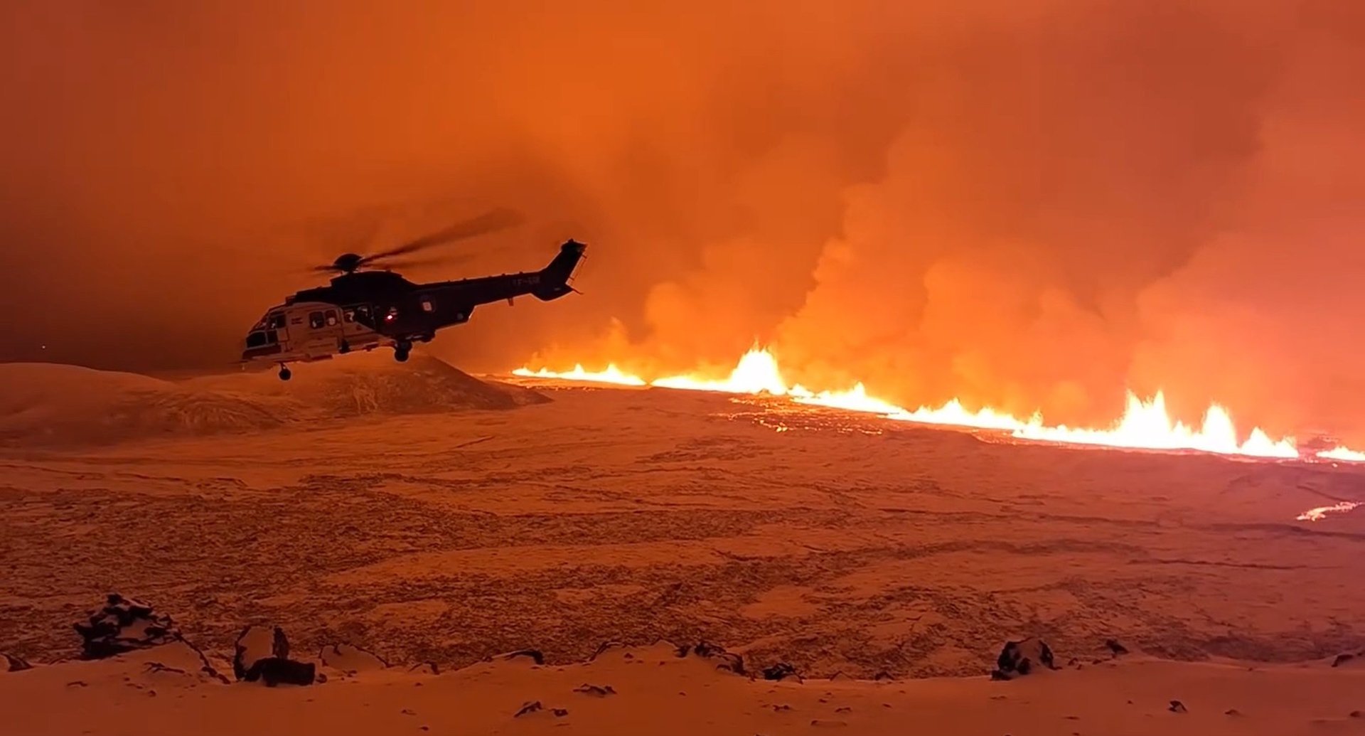 A helicopter from the Icelandic Coast Guard flying over the volcanic eruption north of Grindavik, Iceland - 18 December 2023