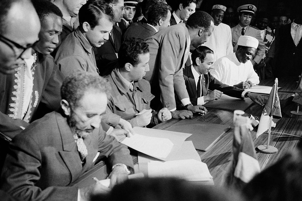 Haile Selassie signing a document
