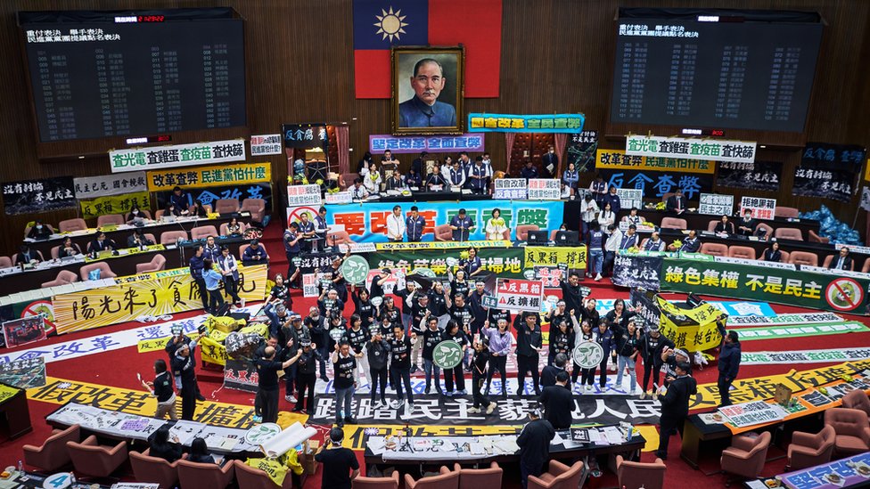 Members of the Democratic Progressive Party (DPP) protest inside the Legislative Yuan in Taipei, Taiwan, on Tuesday, May 28, 2024. Taiwan lawmakers passed legislation that could curb the authority of newly inaugurated President Lai Ching-te as thousands of protesters gathered outside parliament to oppose the changes. Photographer: An Rong Xu/Bloomberg via Getty Images