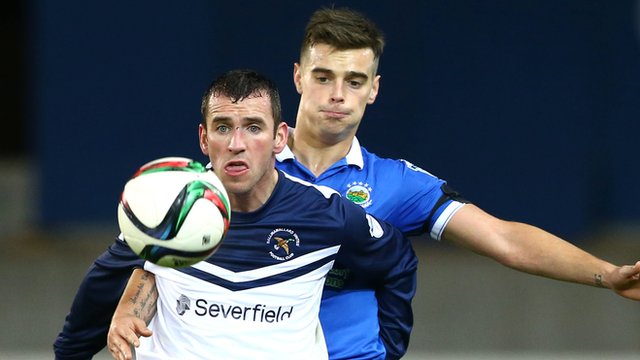 Ryan Campbell and Matthew Clarke in action at Windsor Park