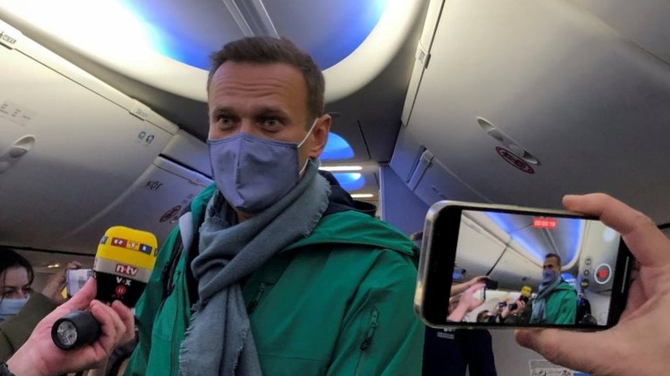Russian opposition leader Alexei Navalny is seen on board a plane before the departure for the Russian capital Moscow at an airport in Berlin, Germany on 17 January 2021