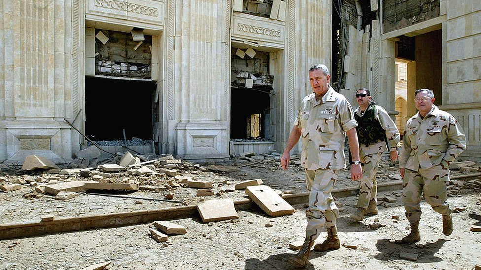 US soldiers in a bombed-out palace in Iraq.