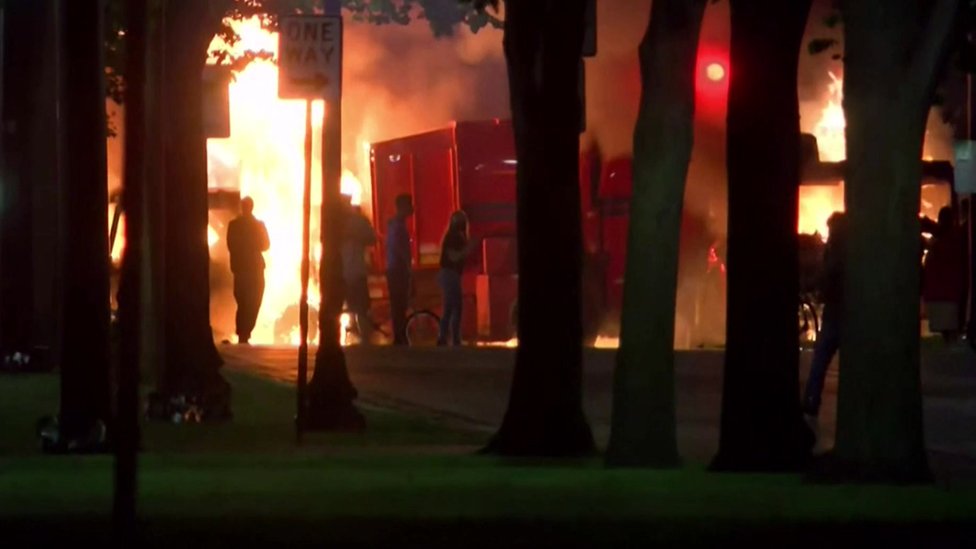 A screen grab from a video shows a fire started by protesters in Kenosha, Wisconsin