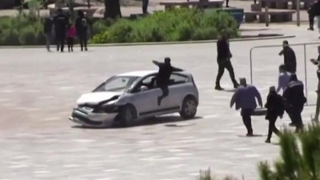 Man jumps through car window to stop dangerous driver in Albania