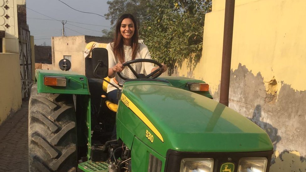 Nav Mann on a tractor during a recent trip to India