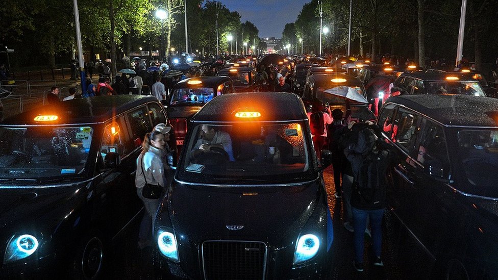 London black taxis line The Mall leading up to Buckingham Palace