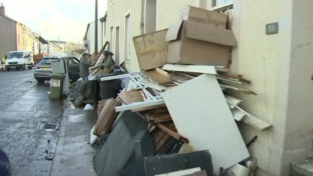 Aftermath of flooding shows damaged furniture
