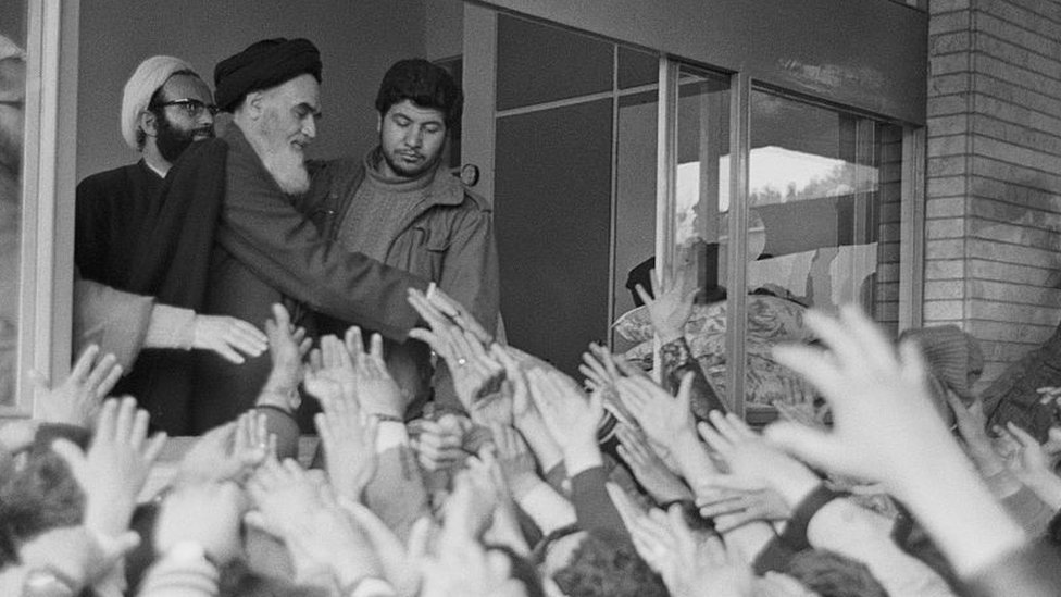 Ayatollah Khomeini greets his followers.