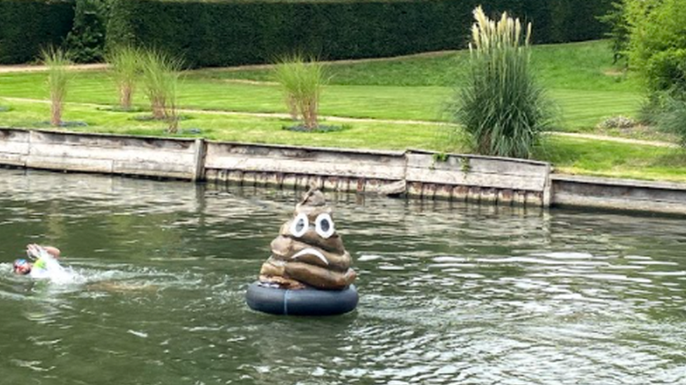 Poo model floating in river