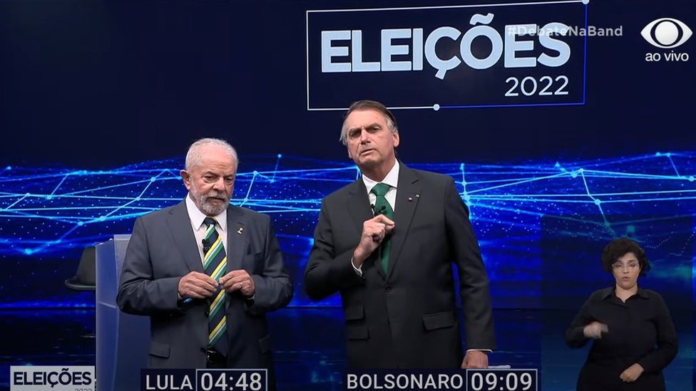Lula e Bolsonaro durante debate na Band