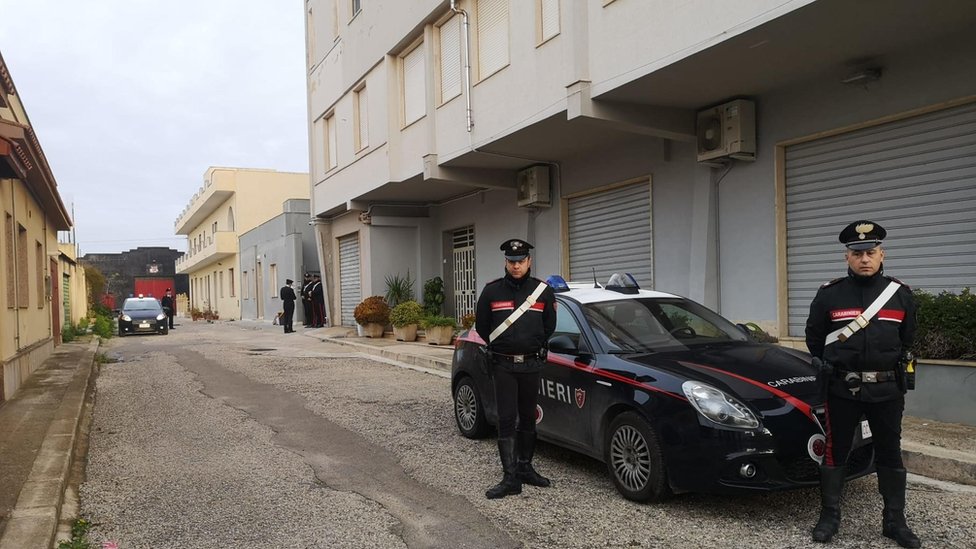 Police stand guard near one of Messina Denaro's three hideouts in Campobello