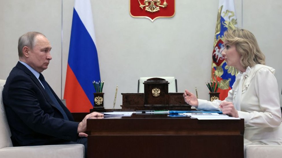 Russian President Vladimir Putin meets with Maria Lvova-Belova, Russian children's rights commissioner, at the Novo-Ogaryovo state residence, outside Moscow, on February 16, 2023