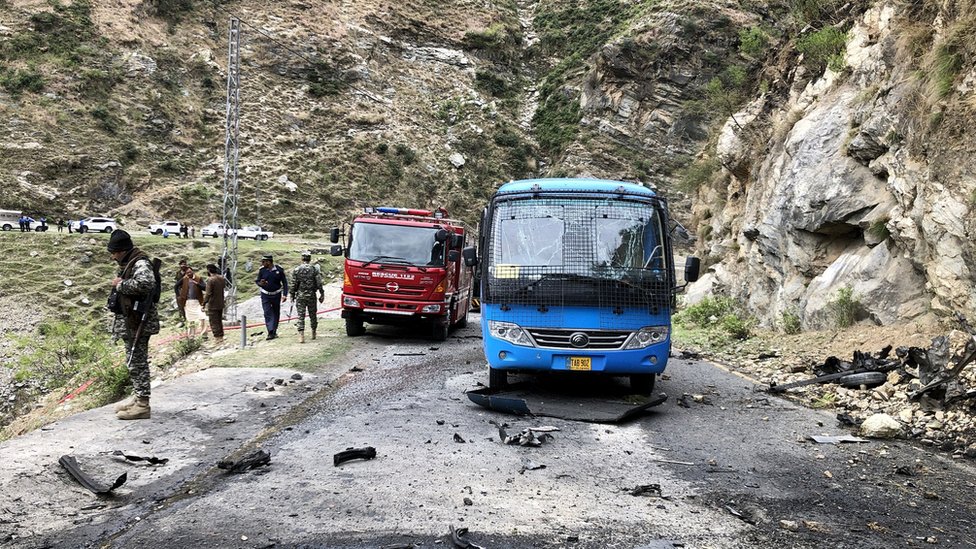 Security personnel inspect the site of a suicide attack near Besham city in the Shangla district of Khyber Pakhtunkhwa province on March 26, 2024. Five Chinese nationals working on a major dam construction site were killed along with their driver on March 26 when a suicide bomber targeted their vehicle in northwest Pakistan, officials said.