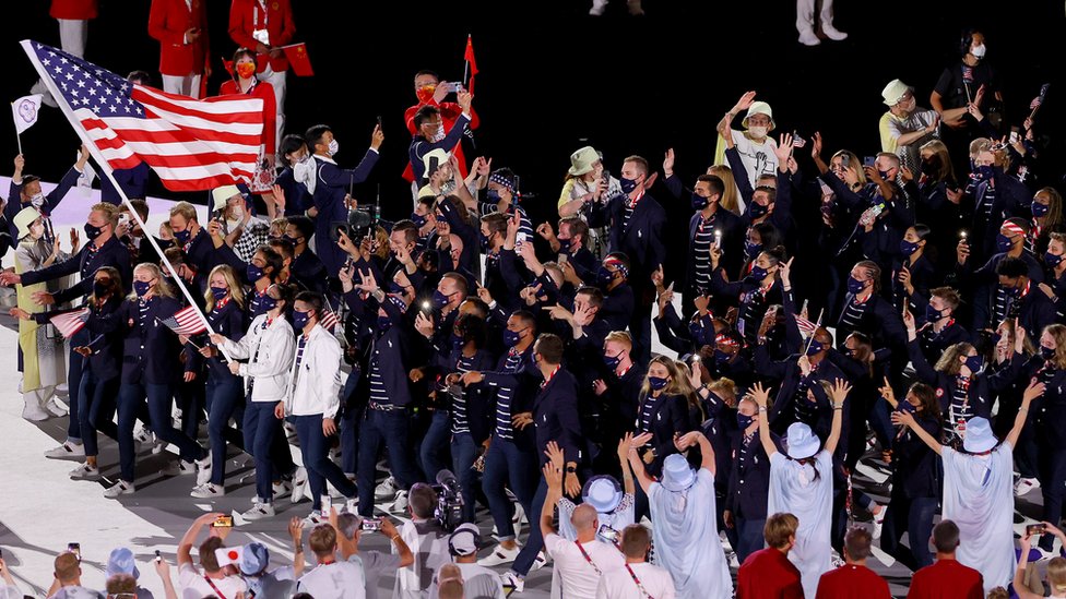 Flag bearers Sue Bird and Eddy Alvares of Team United States lead their team out during the Opening Ceremony of the Tokyo 2020 Olympic Games at Olympic Stadium on July 23, 2021 in Tokyo, Japan.