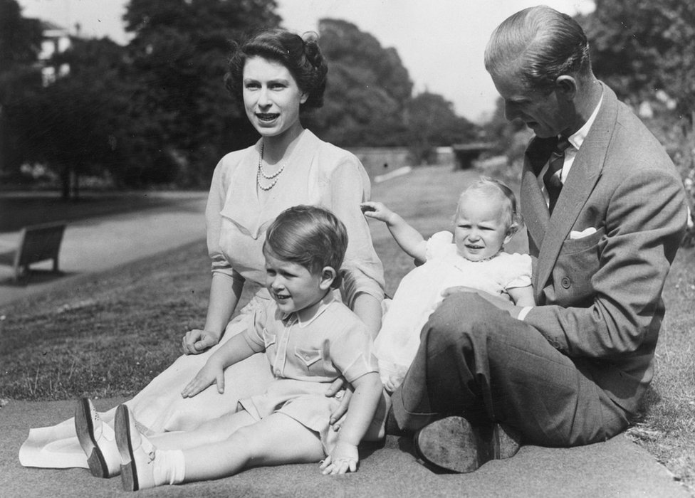 9th August 1951: Princess Elizabeth and Prince Philip, Duke of Edinburgh with their two children, Prince Charles and Princess Anne in the grounds of Clarence House, London