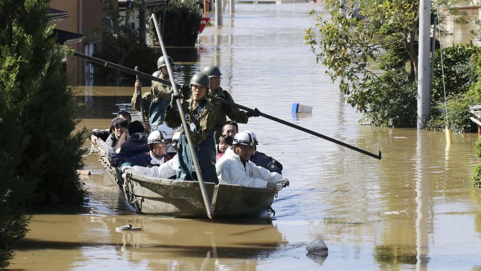 Soldiers use boats to rescue residents hit by floods in Japan