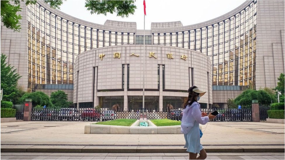 A woman in action in front of the People's Bank of China (PBoC) building on June 9, 2021 in Beijing, China