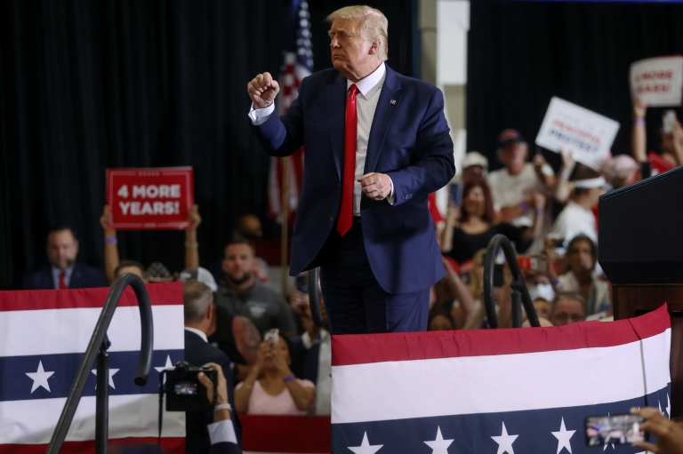 U.S. President Donald Trump dances to the song "YMCA" as he concludes a campaign rally with supporters in Henderson, Nevada, U.S. September 13, 2020