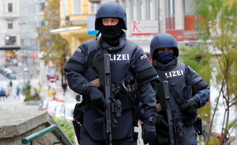 Armed police officers patrol near the site of a gun attack in Vienna, Austria, November 4